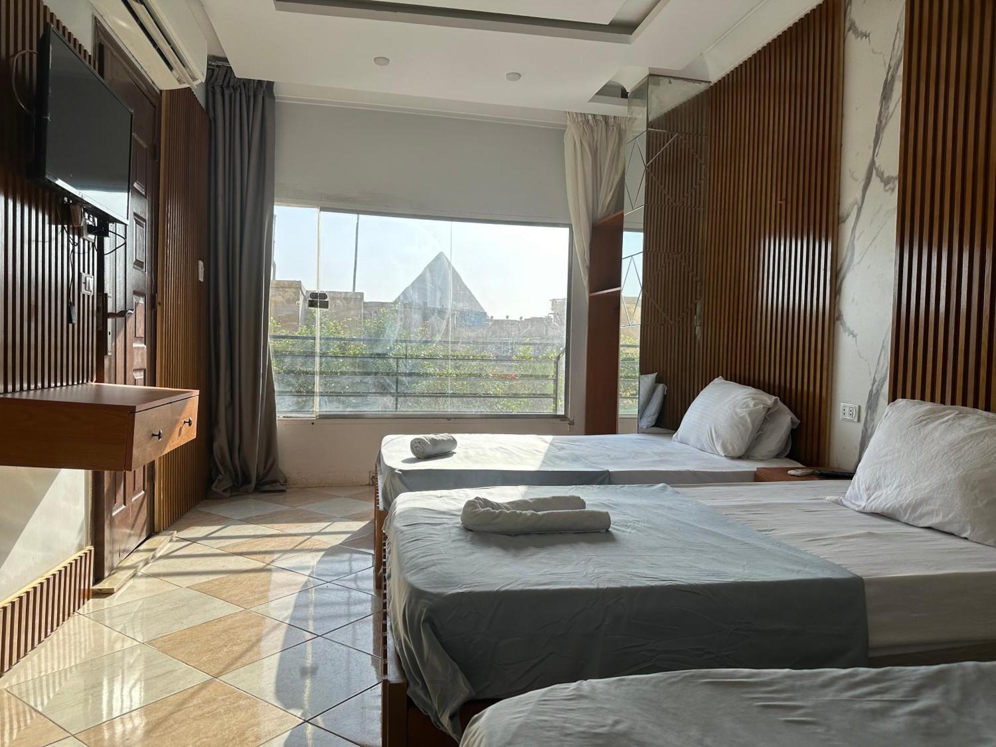 Pyramids Family Inn Kafrat al Jabal Bagian luar foto
